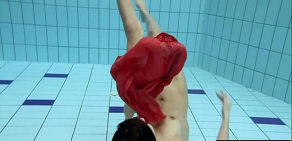  Sexy brunette Anna in red dress swimming